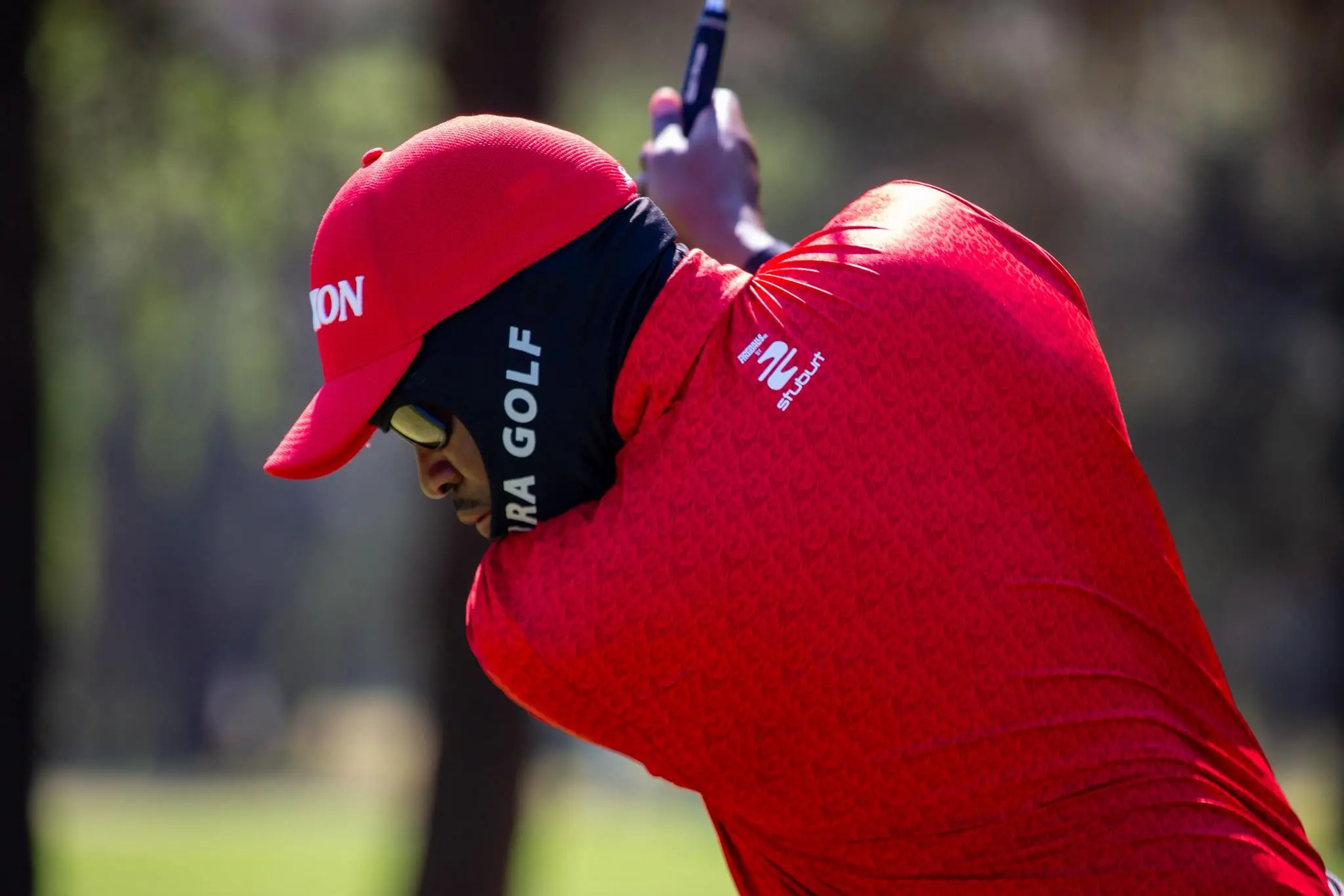 Elite Golfer Swings on Championship Fairway